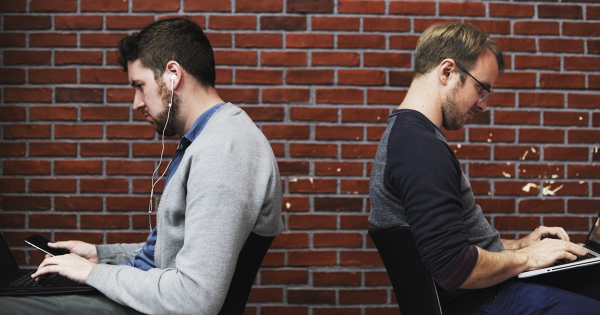 two men working back to back