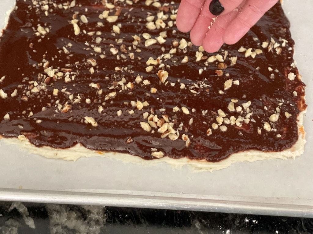 adding hazelnuts to Keto Chocolate Bark