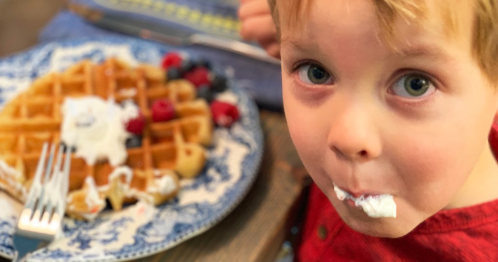 little boy eating waffles 