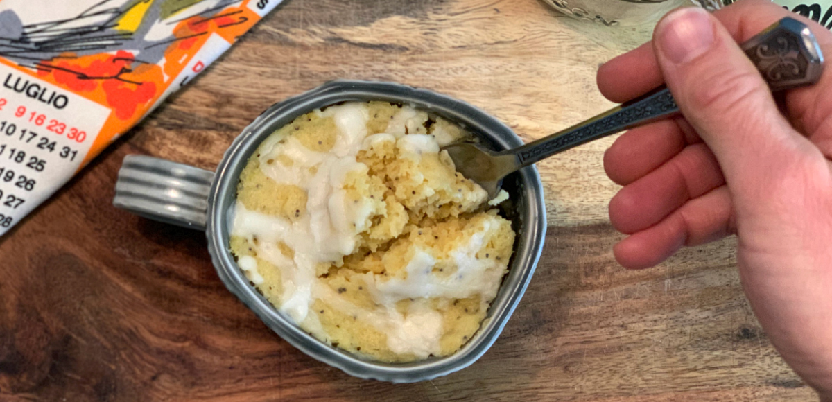 Low Carb Lemon Poppy Seed Mug Cake - a fork scooping out a bit of cake