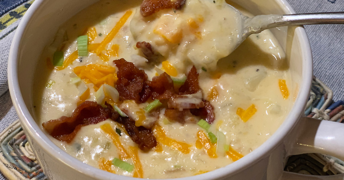 Creamy cauliflower chowder (keto comfort food) in a cup with added bacon and cheese