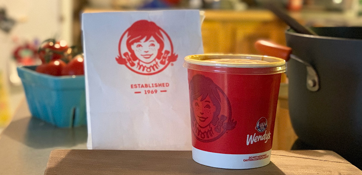 Wendy's Chili Copycat Keto Recipe - cup of Wendy's chili next to a Wendys bag