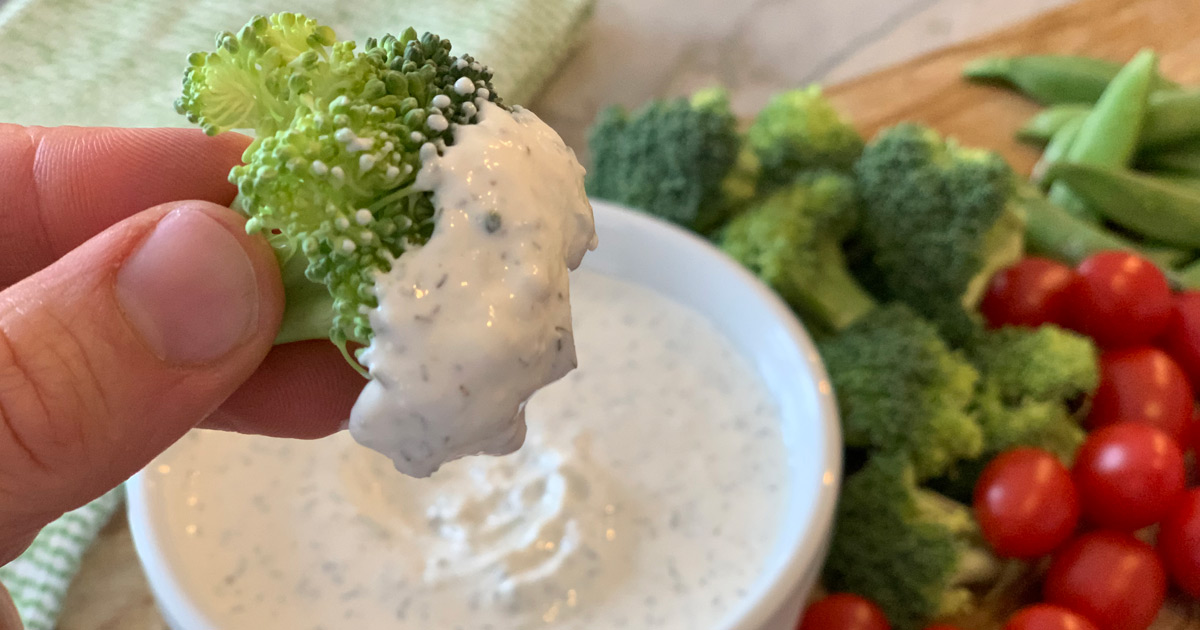 Keto Homemade Ranch Dip - broccoli dipped in a bowl of ranch dip