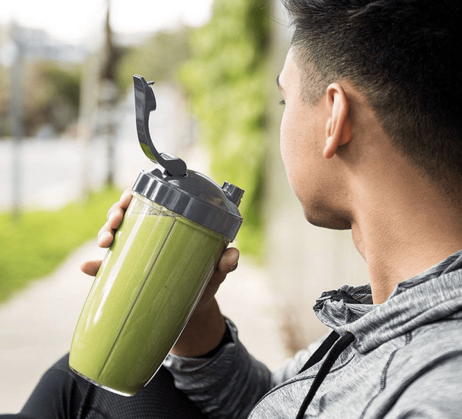 Man drinking a smoothie from the NutriBullet Pro 