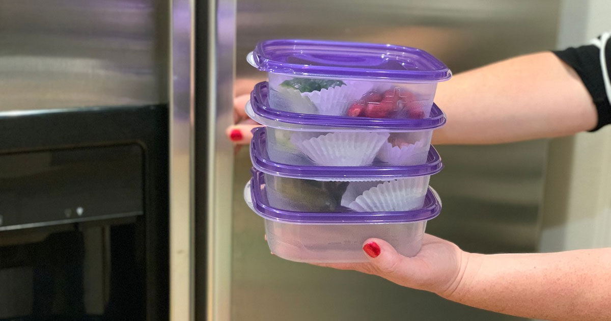 make-ahead keto snack boxes – containers stacked and going into the fridge