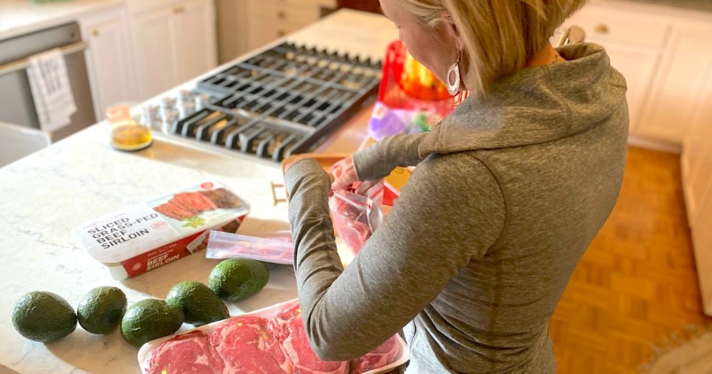 woman preparing keto foods on kitchen island 