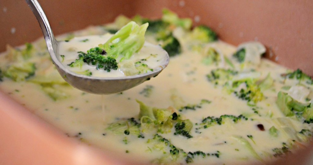 laddling keto broccoli cheddar soup