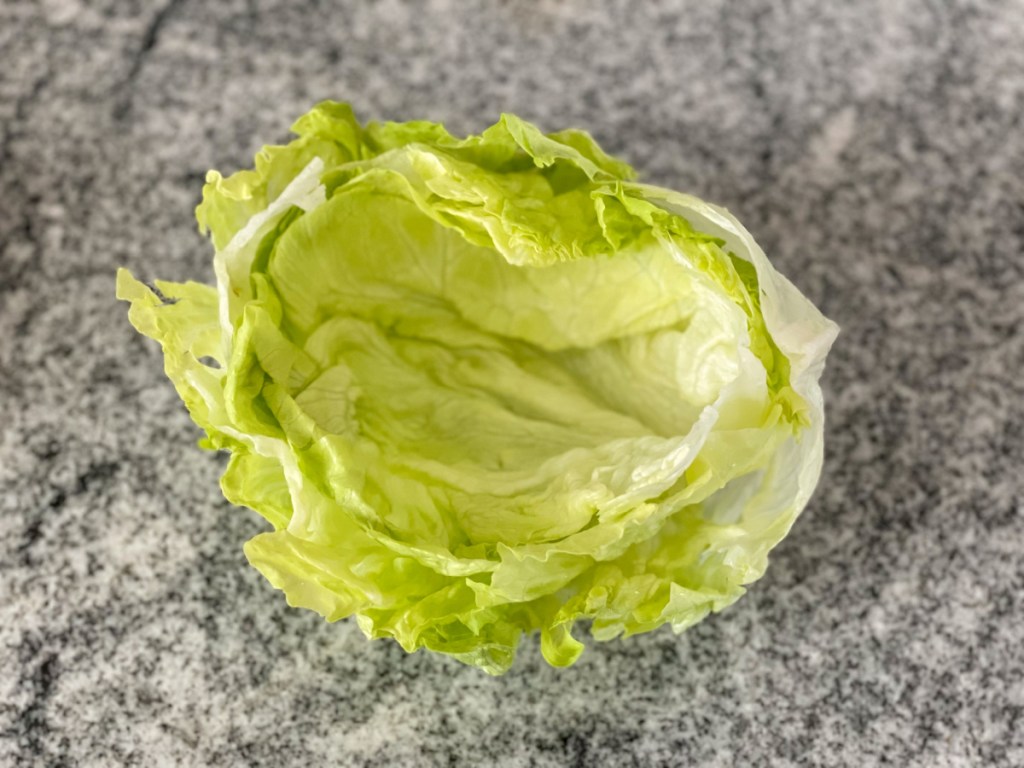 three leaves of iceberg lettuce stacked together to form a bowl