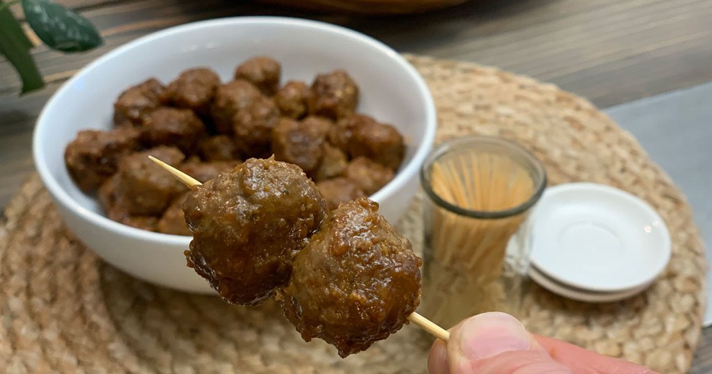 Low-Carb Sweet Savory Apricot Glazed Meatballs - A tooth pick with two tasty meatballs