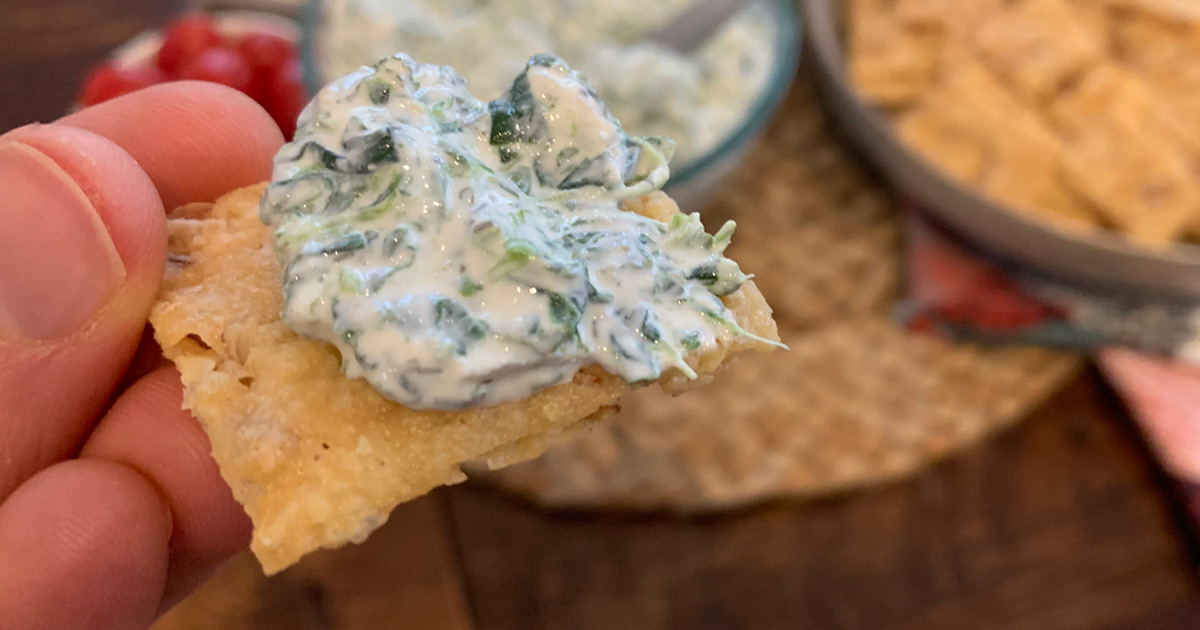Game Night Keto Spinach Dip - spinach dip smothered on a cracker