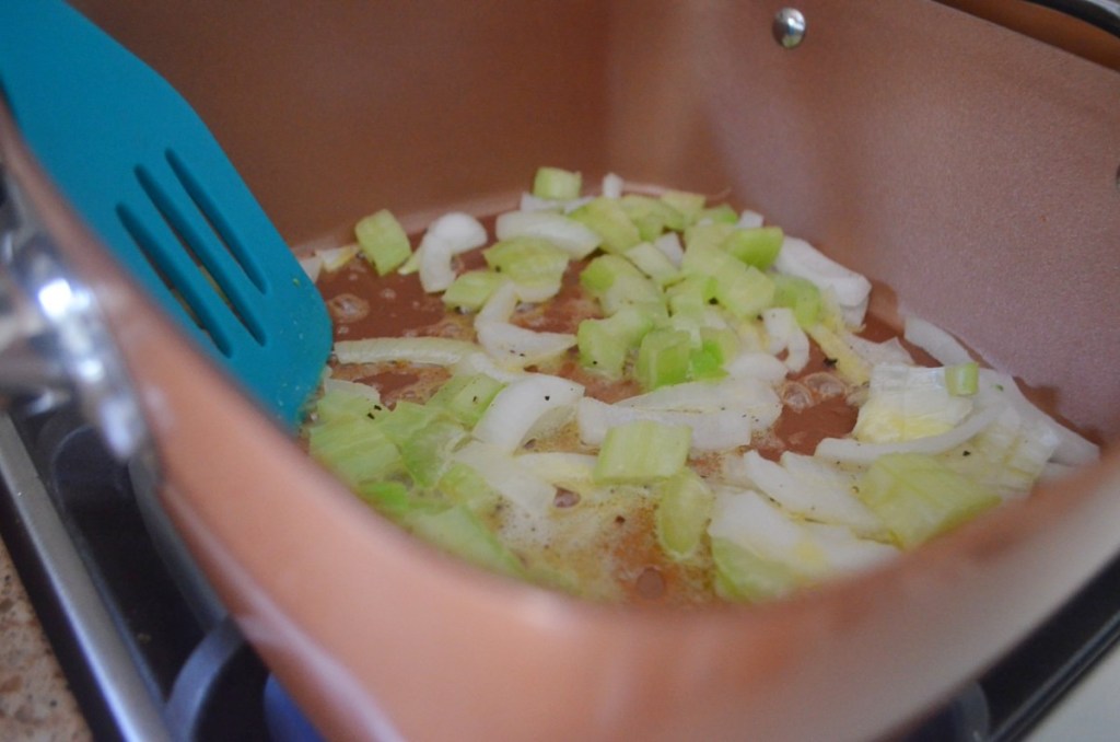 stirring celery, onions, and butter in pan