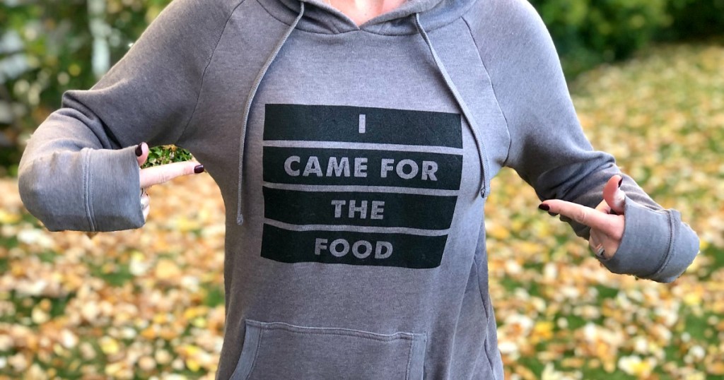 Woman wearing hoodie that reads "I came for the food"