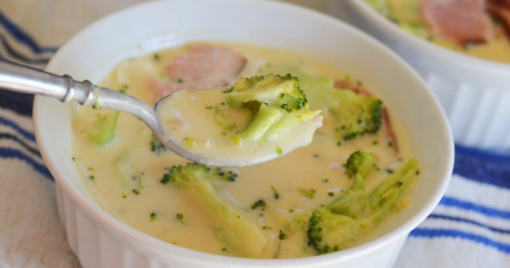 spoon with keto broccoli cheddar soup