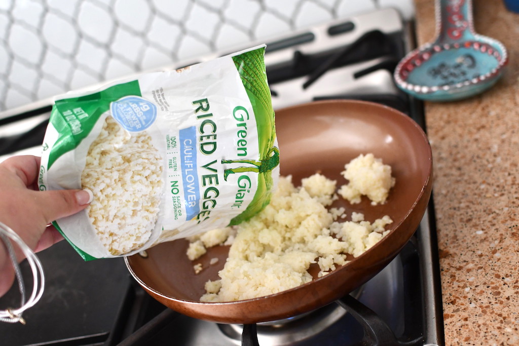 pouring bag of Green Giant riced cauliflower into pan 