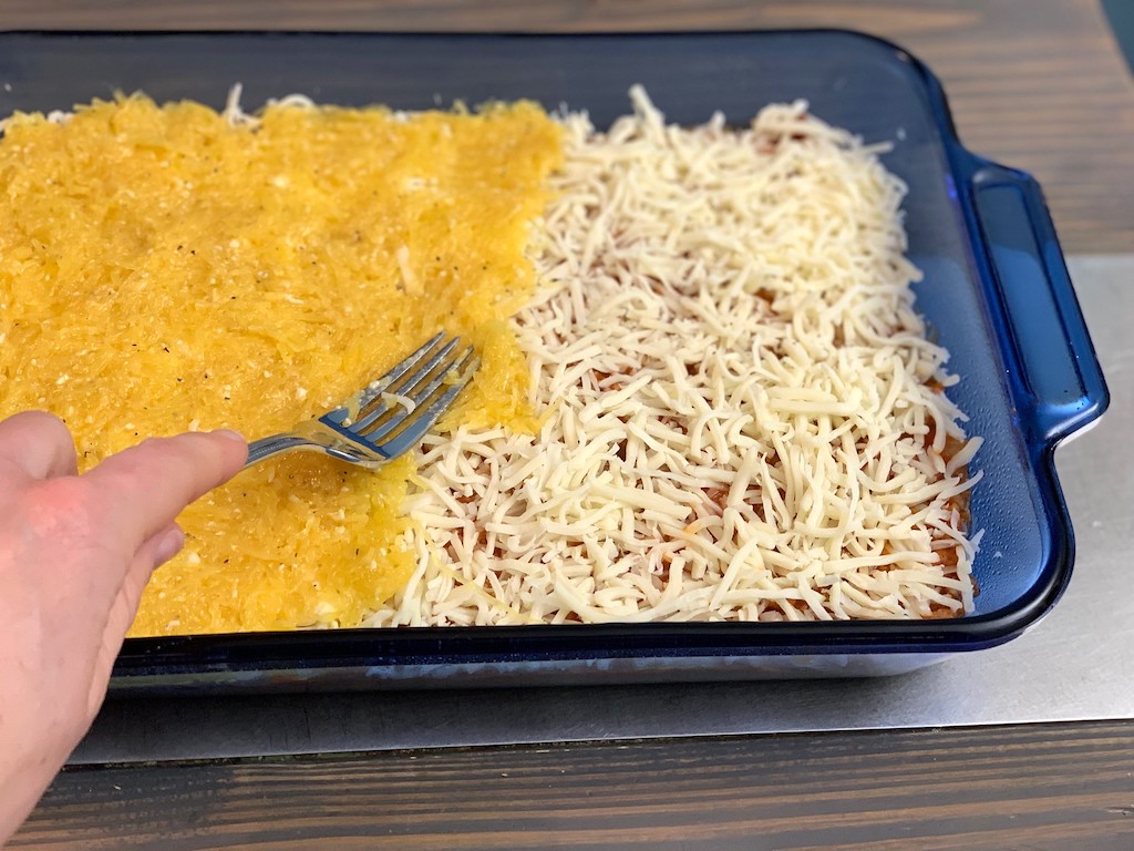 spreading spaghetti squash into casserole dish 