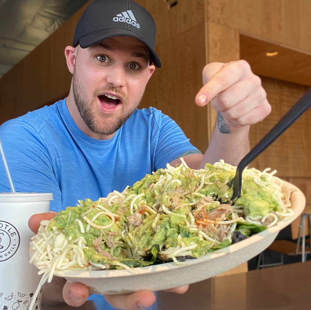 man pointing at Chipotle keto bowl