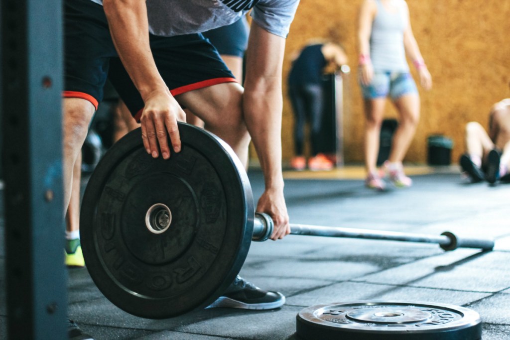 man with weights in gym