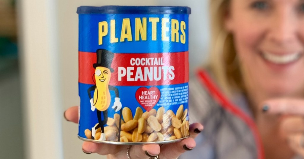 woman holding canister of peanuts