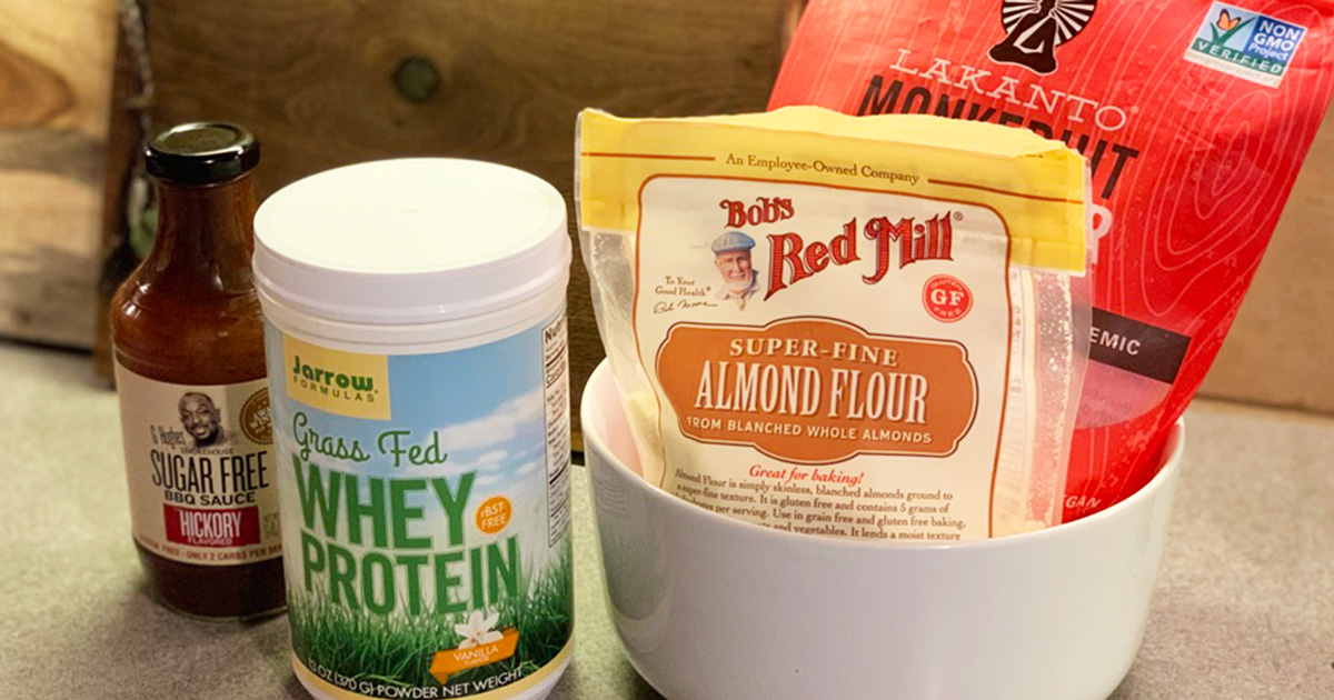 A display of pantry favorites including protein powder, almond flour and BBQ sauce