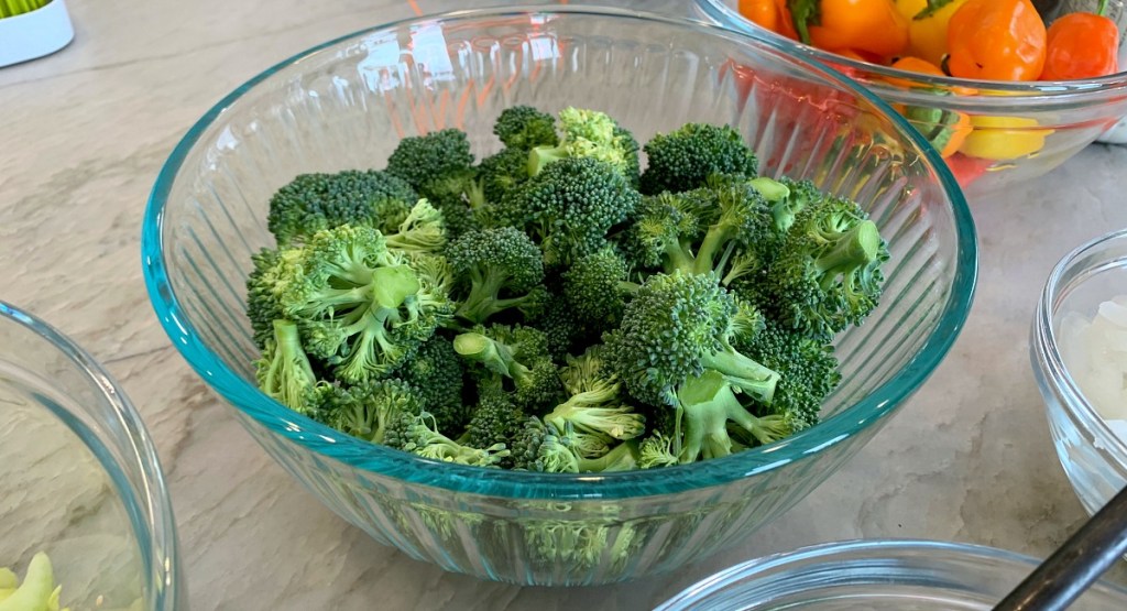 chopped broccoli in glass bowl