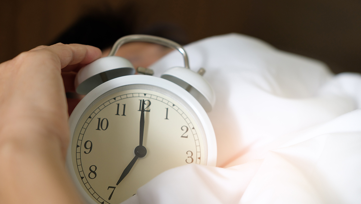 alarm clock in bed