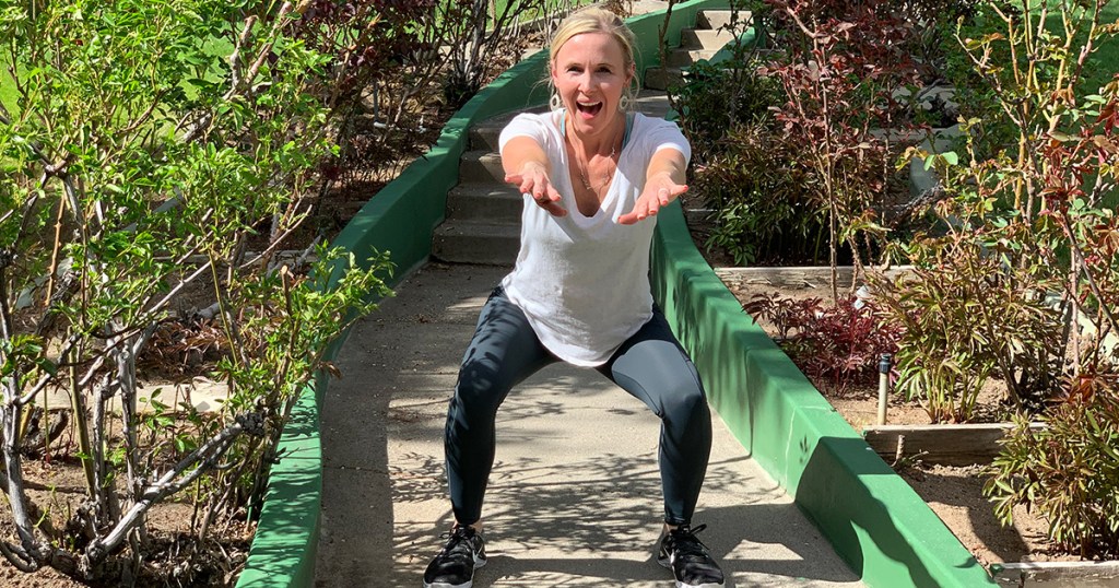 woman outside doing a squat