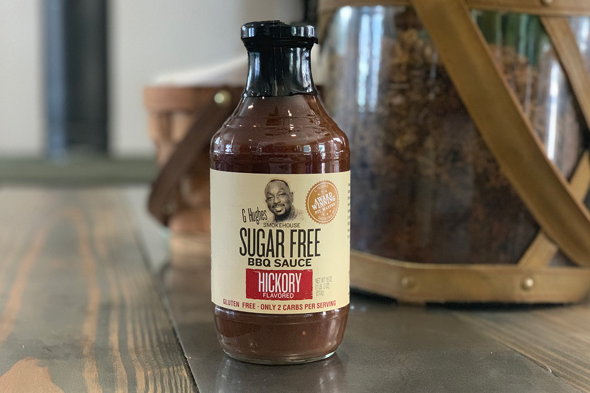 A table with a bottle of sugar-free BBQ sauce on it