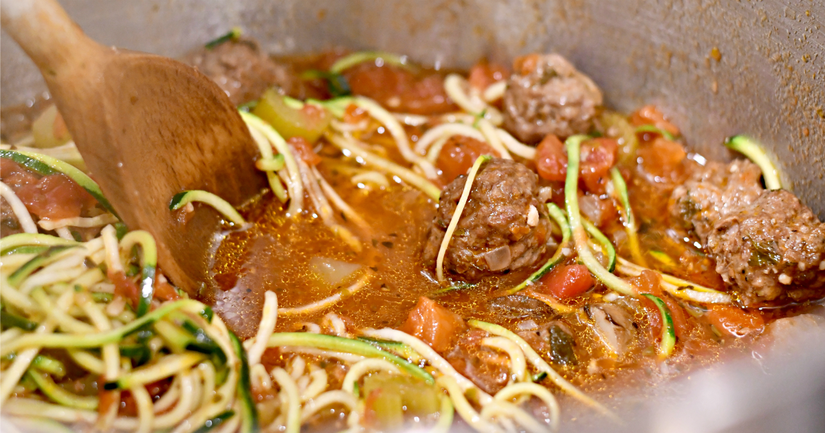 Hearty Italian Meatball Soup with Zucchini Noodles in the pot