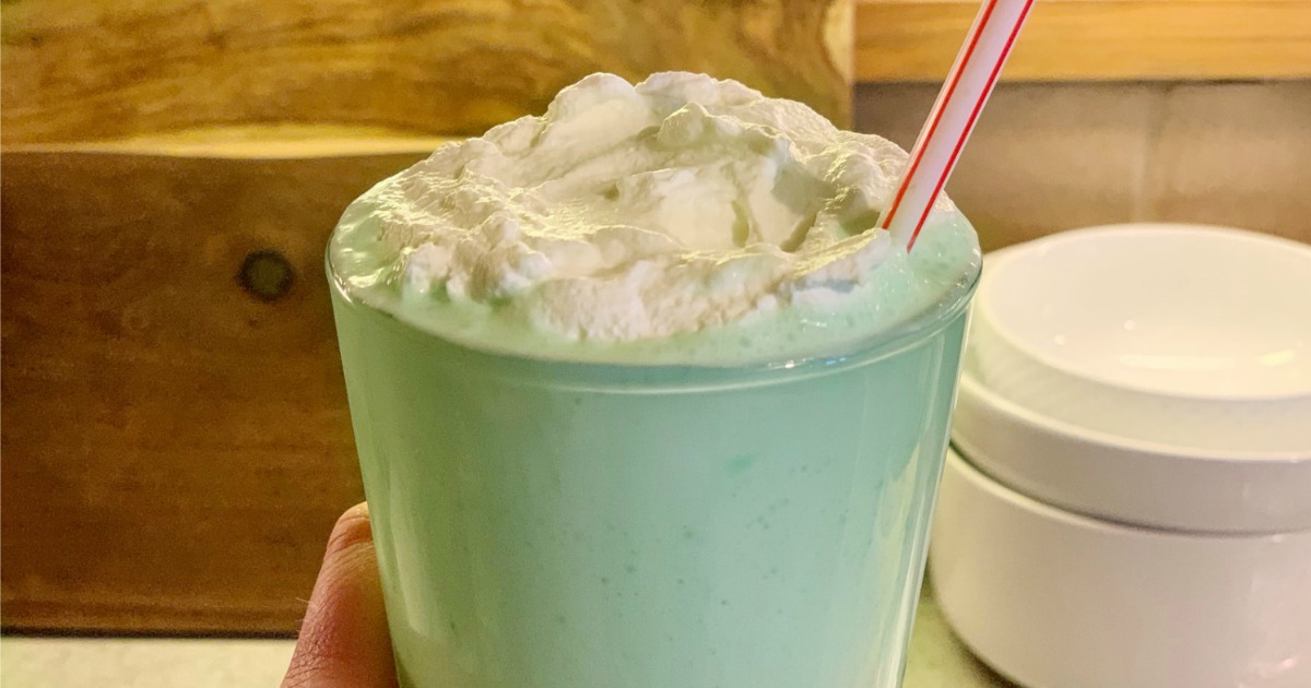 glass with low carb shamrock shake topped with keto whipped cream