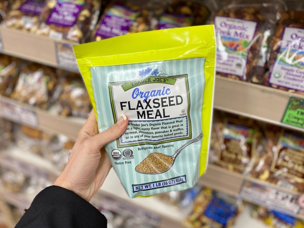 holding bag of organic flaxseed meal