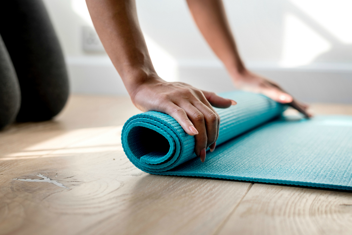 person using yoga mat, one of the easy ways to exercise