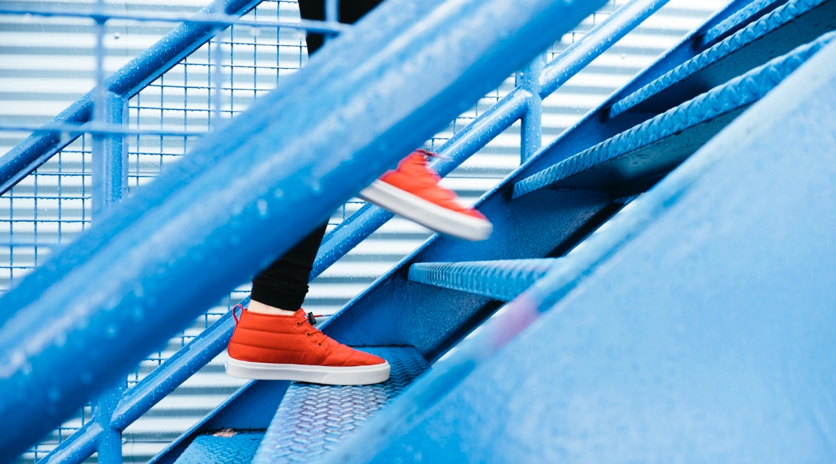 person running up stairs, one of the ways to exercise daily