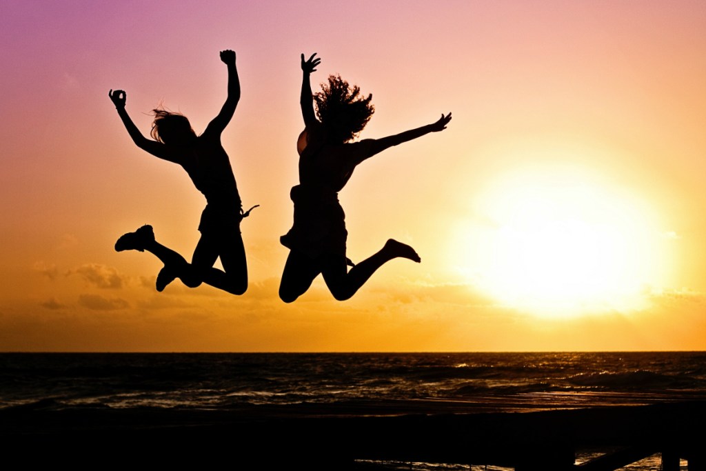 two people jumping in air