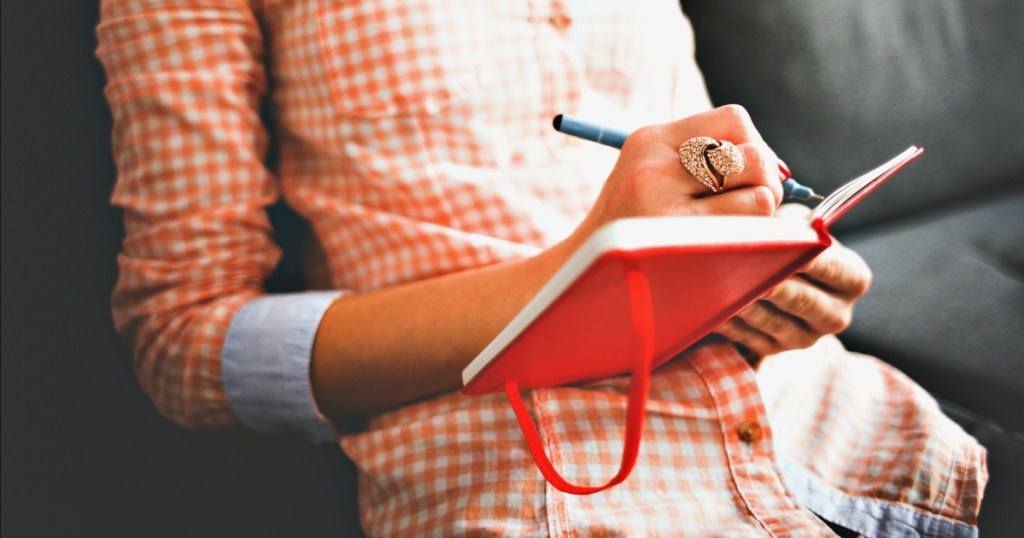 woman writing in journal