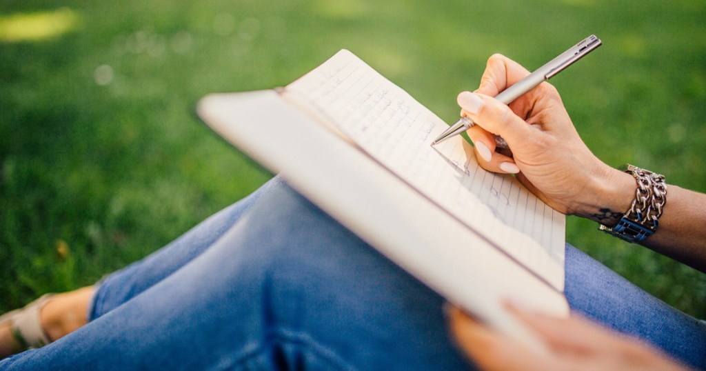 woman writing in journal