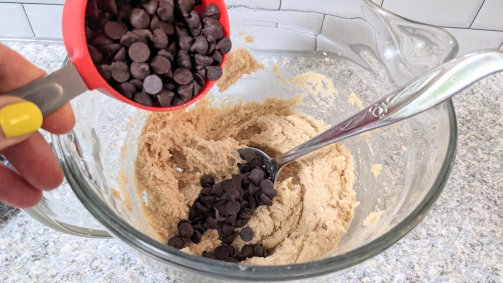 adding chocolate chips to keto chocolate chip cookie batter