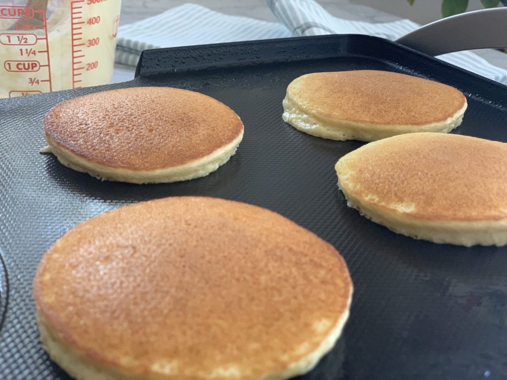 4 pancakes on a griddle