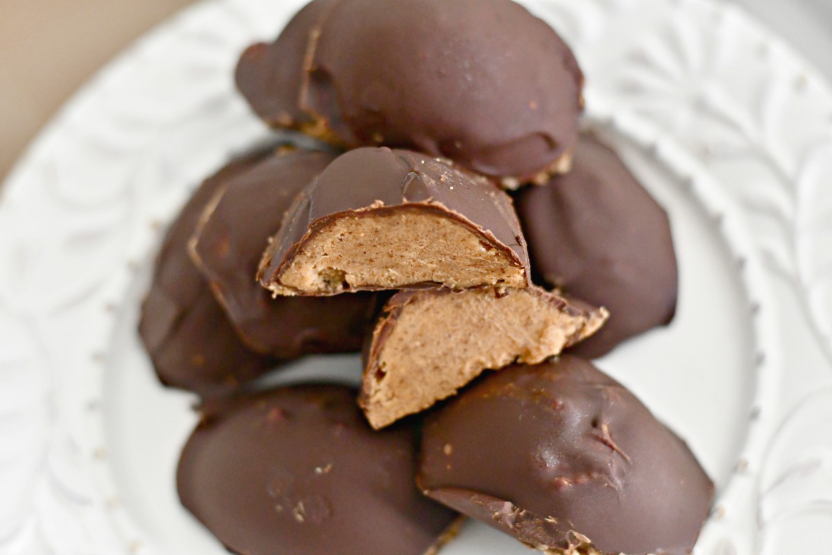 sugar free keto chocolate almond butter easter eggs cut in half on a plate 