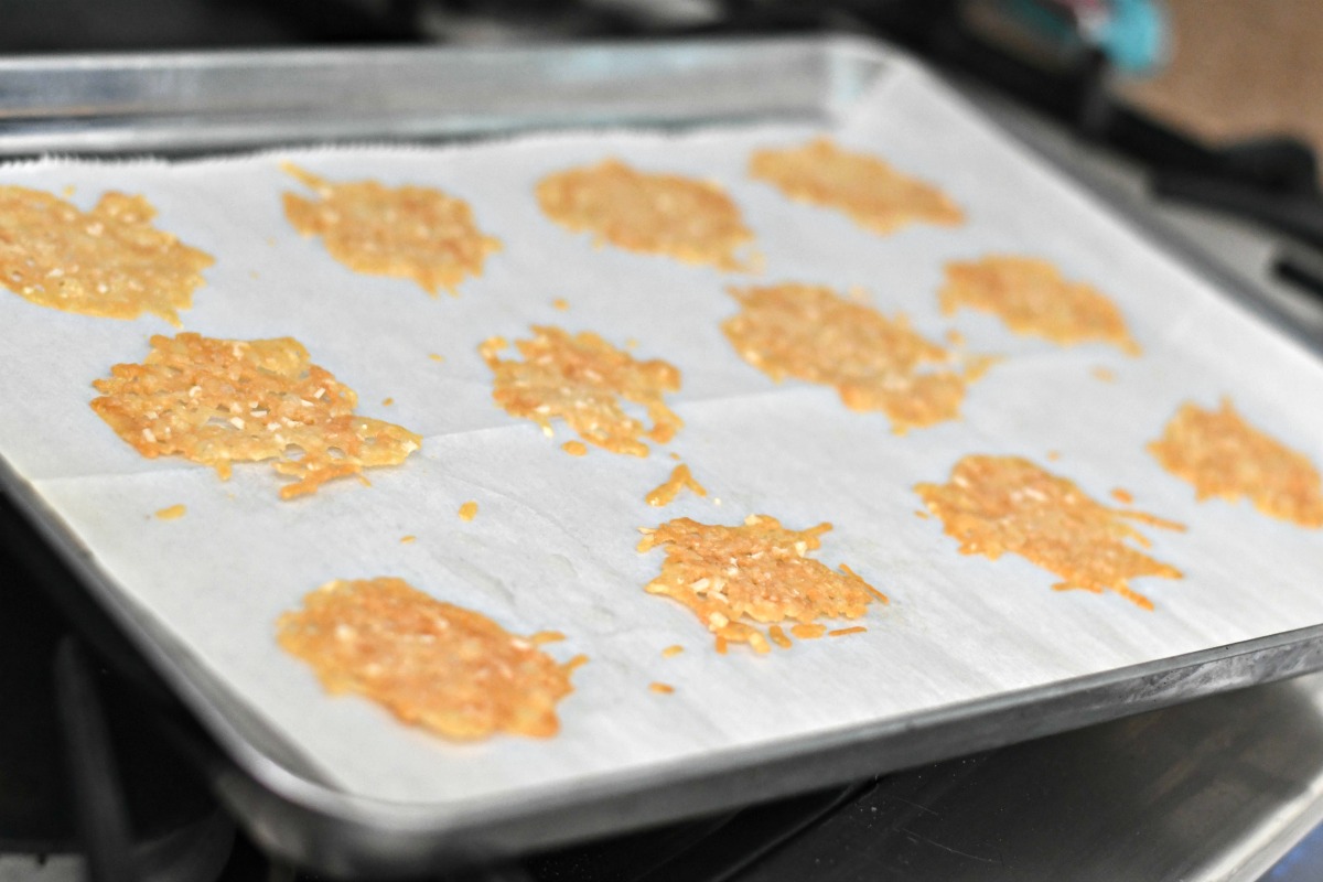 homemade cheese whisp crackers on a baking sheet