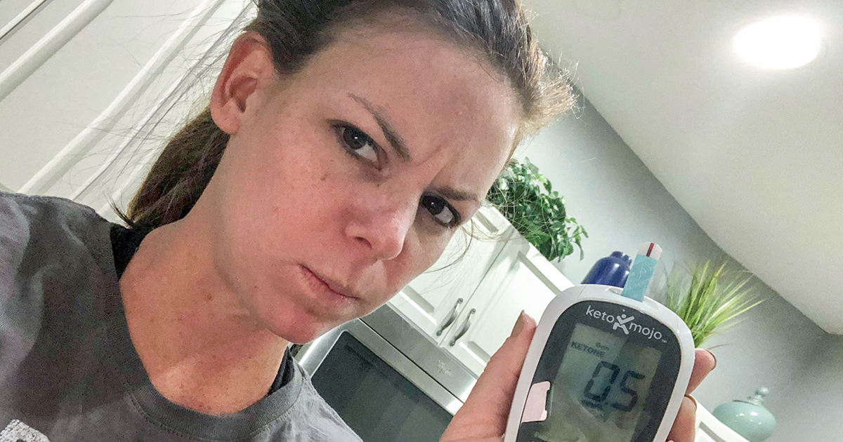 erica holding up keto mojo monitor