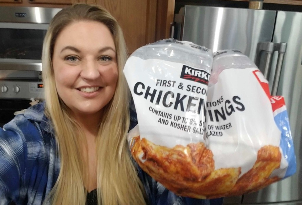 woman holding bag of chicken