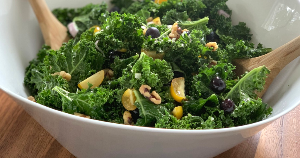 tossing kale super food salad