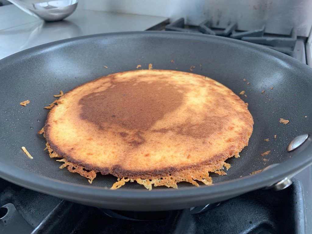 keto quesadilla cooking in pan 