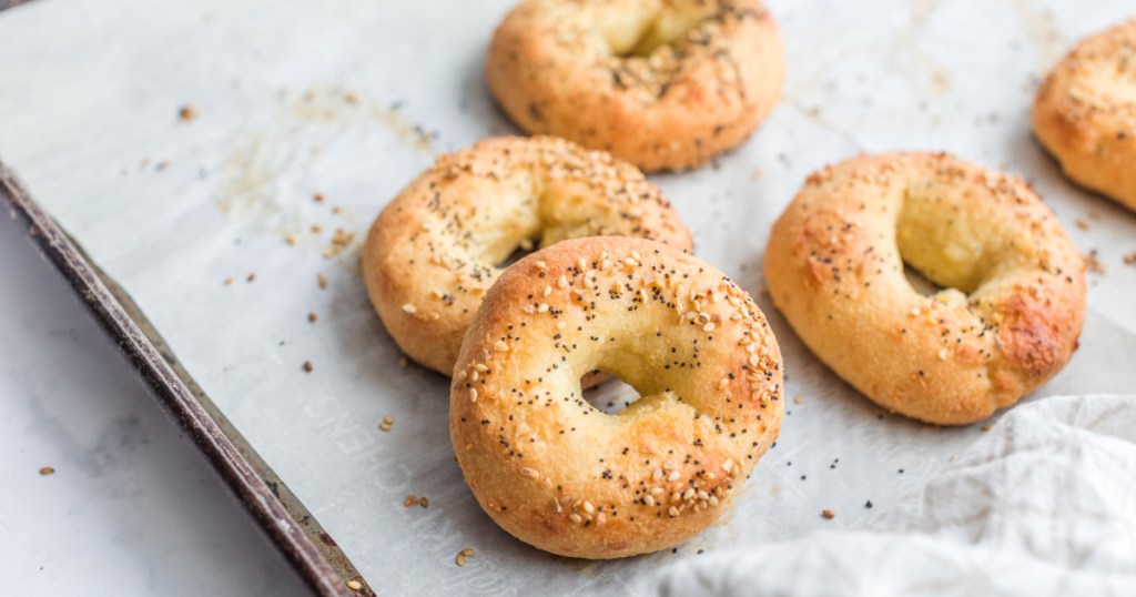 keto bagels on a baking sheet pan