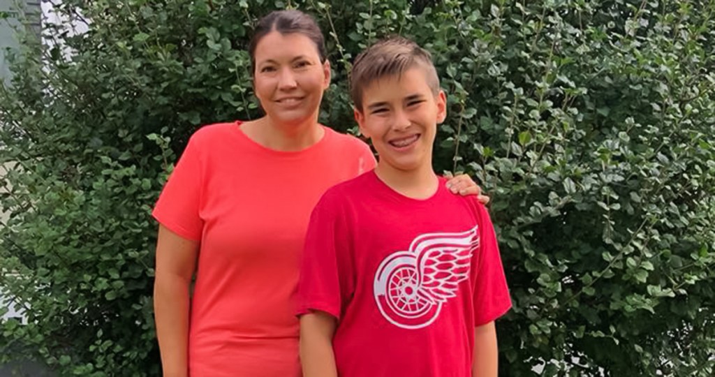 young boy and his mom smiling