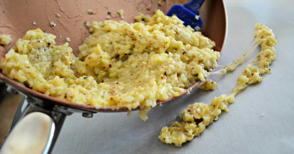 making cauliflower pizza crust in a skillet