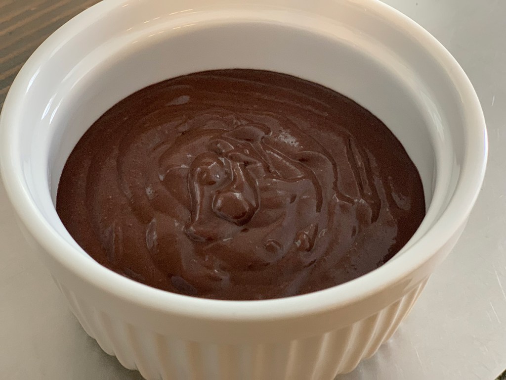 chocolate mug cake batter in ramekin