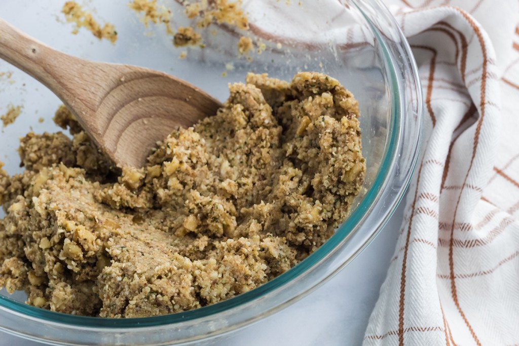 mixing up oatmeal cookie dough in bowl