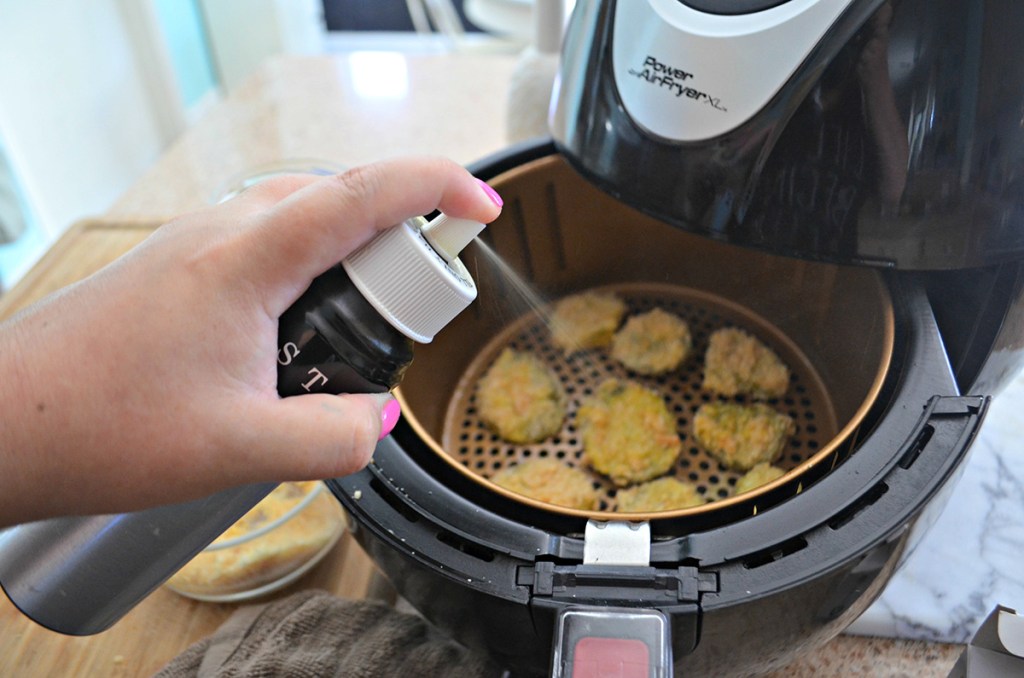 oil mister spraying coating pickles in air fryer