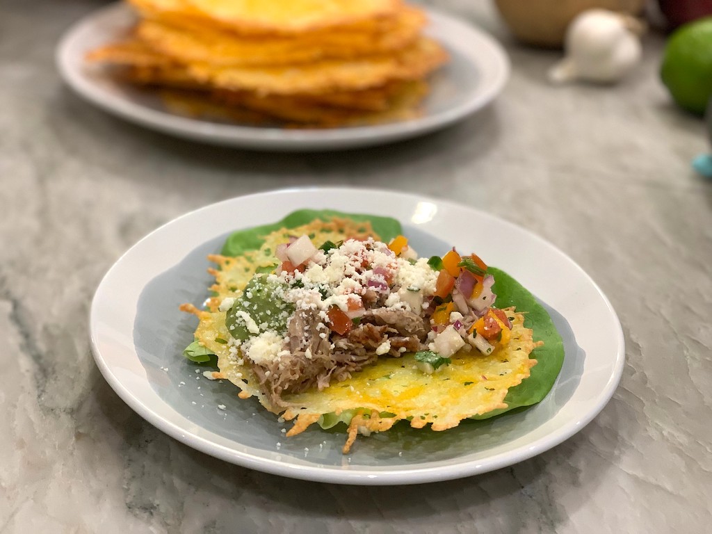 shredded pork on top of cheese shell 